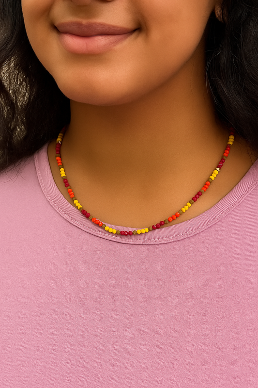 summer necklace featuring a vibrant crystal beaded strand in red, orange, and yellow tones